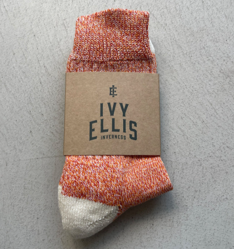 Packaged pair of orange Ivy Ellis socks