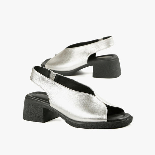 Side view of silver slingback sandals