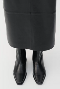 Black ankle boots worn with black leather skirt