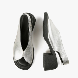 Silver slingback sandals with black rubber heel