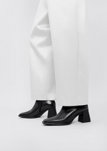 Load image into Gallery viewer, white pants with black Hedda heeled boots