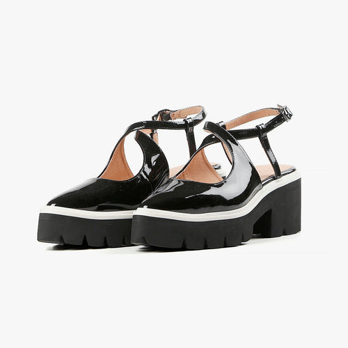 black patent leather mary jane with wrap around ankle strap with black and white lugg sole