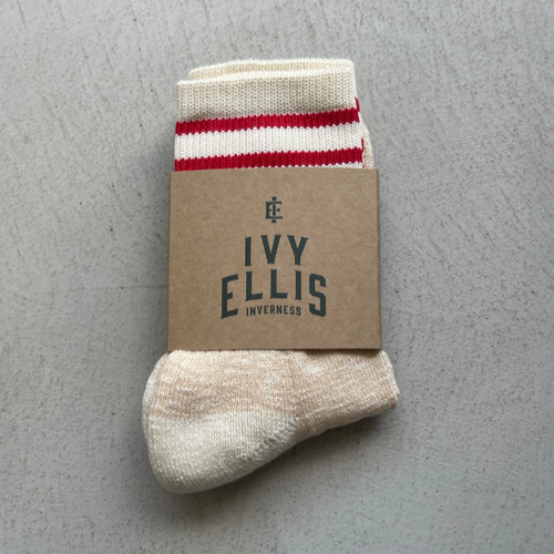 Ivy Ellis tan and red socks in packaging