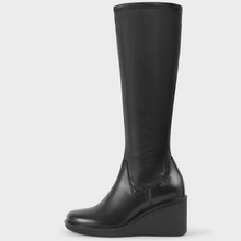 Load image into Gallery viewer, Side view of black knee high stretch boot with wedge heel