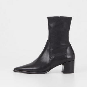 side view of black pointed stretch ankle boots with heel