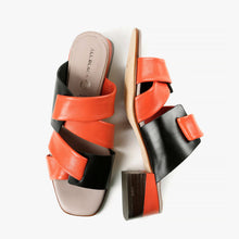 Load image into Gallery viewer, Open toed orange and black slip-on mules with criss cross straps